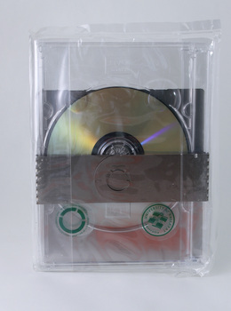 DVD printed full colour single sided, housed in a clear plastic DVD box, wrapped in custom-cut brushed aluminium, two clear stickers featuring circular graphic and UB logo. All enclosed in an cellophane bag.