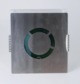 Photograph of front of square format promotional package (plastic case, aluminium wrap and DVD)