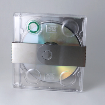 Photograph of reverse of square format promotional package (plastic case, aluminium wrap and DVD)