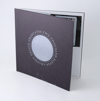 Black textured card cover with single colour silver print, circular print with text running around circumference.