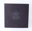 Black textured card back cover with single colour silver print.