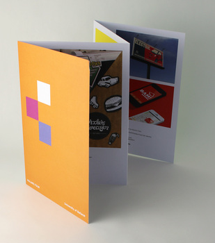 Orange cover, concertina pages show some student work.