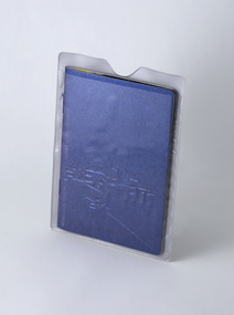 Small blue booklet contained in a plastic sleeve with clear front.