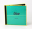 Blue paper sleeve housed in yellow plastic case (so printed item appears teal coloured). Large wording, lower case "blue".
