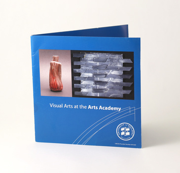 Front cover of 6-page roll-fold brochure. Blue with white reversed text and student images.