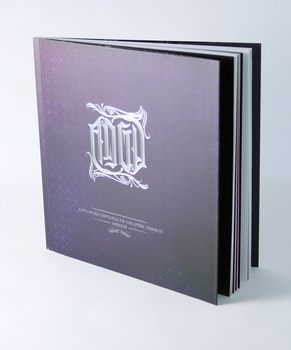 Square format black book cover, silver foil emboss of AGDA letterforms in blackletter/tattoo style.
