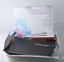 Opened package, introductory text inside lid, and display of folded student posters.