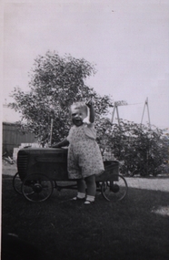 Photograph - Photograph - black and white, Child with pedal car
