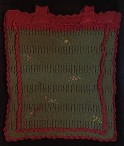 Knitted hot water bottle cover