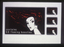 Black matchbox art with traditional image of "redhead" matchbox girl looking over shoulder