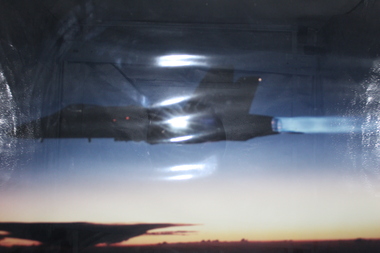 f18 fighter doing fuel dump via after-burner at dusk