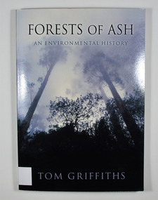 Paperback. Front cover has a photograph of trees.