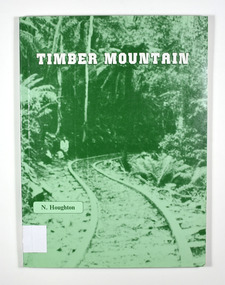 Paperback. Front cover has an old photograph of a timber railway leading into a forest. There is also a man standing at the side of the railway.