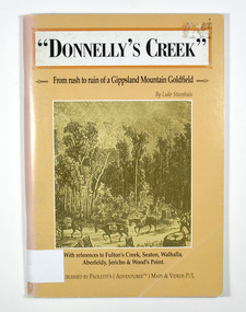 Paperback. Front cover has a drawing depicting two horses carrying packs followed by a man mounted on a horse. There is also two men on foot following with packs and walking poles. They are walking along a forest track that has some tree stumps alongside it.The back cover has two colour photographs. The top one is of an old wooden building with what appears to be an attached lean to. Both of the buildings have stone chimneys. There is a group of people sitting and standing outside the main building. The bottom photograph appears to be the ruins of a building and a fence. There are three people viewing the ruins.The captions accompanying the photographs are: History revisited - O'Sullivans Old Toombon Hotel Recreated and Remnants of a Bygone Mining Era.