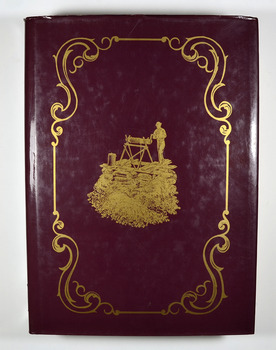 Hardcover. Front cover has an illustration of a miner standing next to a hole in the ground which is surrounded by logs. He is standing on top of a platform made out of planks of wood and he is turning a handle on a hand winch to bring up a bucket.