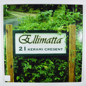 Hardcover. Front cover has a photograph of the sign which was on the street outside of Ellimatta. The sign is in green decorative lettering, has a green frame and is positioned between two pine posts. Behind the sign is a variety of shrubs. In the background the driveway of the property can be seen.