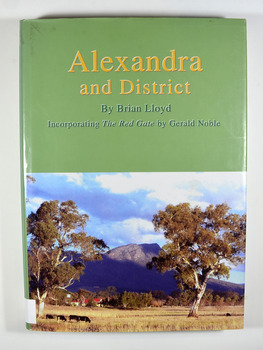 Hardback. Front cover has a photograph of a farmhouse in a paddock with Cathedral Mountain in the background. Back cover has a circular emblem that has a miner digging, a pump house and poppet head and some bales of wool. The words 'Founded on gold wool and butter' surround the centre. There is also a photograph of the main street of old Alexandra with a stagecoach drawn by two horses that has three people seated in and on the stagecoach along with some luggage on the roof.