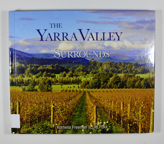 Hardcover. Front cover has a photograph of a winery surrounded by hills.