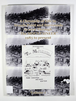 Paperback. Front cover has 3 of the same black and white photograph of old Woods Point. There is also a photograph of a Christmas themed front cover of The Mountaineer from December 1991. Back cover has 2 of the same photograph. Photograph is of a family standing next to a car that is parked outside the Wood's Point Hotel. In the background can be seen a shop on the left hand side of the road.