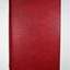 Red cover with the title and volume on the spine. 