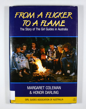 Front dust cover has a photograph of a group of Girl Guides sitting around a camp fire reading.