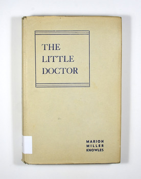 Dust cover is buff in color and the title and author's name is in navy blue lettering on the front cover and spine.