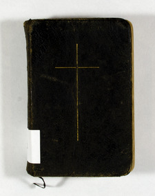 Shows a small black book with the title in gold print on the spine. Front cover has a cross in gold.