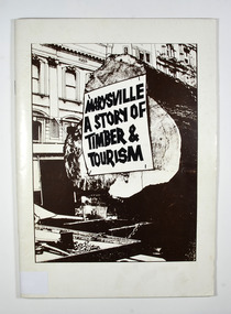 Paperback. Front cover has a drawing of a large log lying on a railway cart; there is also a building in the background.