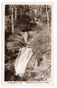 Shows Steavenson Falls, Marysville, Victoria. Shows three cascades flowing down a heavily forested hill. A log is lying across the last cascade. On the reverse of the postcard is space to write a message and an address and to place a postage stamp. The postcard is unused.