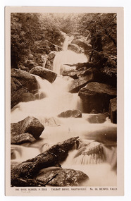Shows Keppel Falls which is accesible from Lady Talbot Drive. Shows the falls cascading over large rocks through the forest. On the reverse of the postcard a handwritten message.