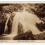 Shows Keppel Falls near Marysville in Victoria. Shows the falls cascading down over some large boulders into a pool of water. There are also a number of fallen logs at the right of the falls. On the reverse of the postcard is a space to write a message and an address and to place a postage stamp. The postcard is unused.