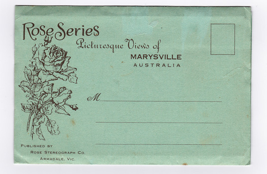 Shows a light green envelope which holds 12 black and white photographs of natural attractions in Marysville and surrounding area. On the front of the envelope is a space to write an address and to place a postage stamp. The envelope is unused.