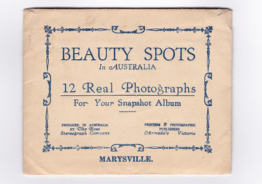 An envelope with 12 black and white photographs of scenic attractions taken in and around Marysville in Victoria. Photographs are gloss finish with the title of the photograph printed along the lower edge of the photographs.