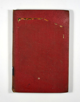 The cover is red. It appears that the book's dust cover has been removed and the picture from the front cover had been adhered to the front cover. That has been partly removed leaving behind residue. The title of the book and the author's name are in black on the front cover.