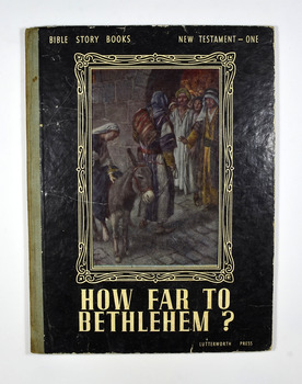 Front cover has a picture depicting Joseph and Mary, who is astride a donkey, talking to a group of men in the doorway of a building. The front cover is black with the title and series name in white. The back cover has information about a series of Bible Picture Story Books that this book is one of.