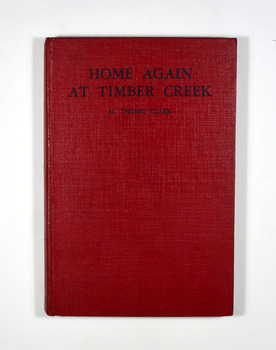 No dust cover. Book is red with the title and the author's name in black on the front cover and spine.