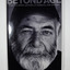 Front cover has a black and white photograph of a bearded man whose story is in the book. The back cover has a photograph of a man with his back to the camera and the blurb about the book.