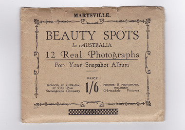An envelope with 12 black and white photographs of scenic attractions taken in and around Marysville in Victoria. Photographs are gloss finish with the title of the photograph printed along the lower edge of the photographs.