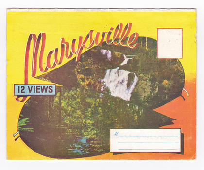 Colour fold out postcard featuring a picture of a waterfall and river scene on the front cover. The postcard contains a number of colourised photographs of Marysville scenes and landscapes including Steavenson Falls, the main street of Marysville, The Crossways Hotel, the Fruit Salad Farm and Nicoll's Lookout. Photographs are printed on both sides of the foldout. On the front of the envelope is a space to write and address and to place a postage stamp. The postcard is unused.