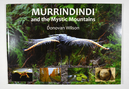 Paperback. Front cover has a large photograph of a lyrebird in full song. Along the lower edge of the front cover are four photographs; a Spotted March frog, the Gould Memorial Drive, a river and a wombat. Back cover has a photograph of the Cathedral Range at dawn.