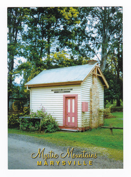 Shows the original Police Station in Marysville in Victoria. Shows a small, weatherboard building with a stone chimney. On the reverse of the postcard is a space to write a message and an address and to place a postage stamp. The postcard is unused.