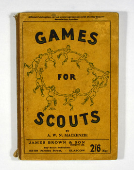 Paperback. Cover is brown. Front cover has title, author detail, publisher details and price. Also an illustration of a group of scouts holding hands in a circle.