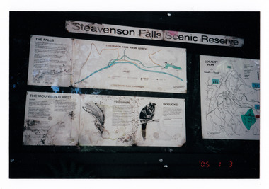 Shows the sign at the Steavenson Falls Scenic Reserve. Shows a map of the reserve, information panels on the mountain forest, the lyrebirds and the bobucks (mountain brushtail possums that are all native to the area and a map showing the location of the falls.
