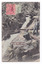 Shows two men, one sitting and one standing, at the edge of the waterfall which is cascading down the mountain. There are a few fallen logs lying across the falls and the falls are surrounded by forest. On the front of the postcard are two postage stamps. One is an orange one  penny Victorian stamp and the other is green. There is also a date stamp in black ink. On the reverse of the postcard is an address in black ink as well as the sender's name.
