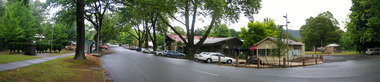 Shows Murchison Street in Marysville in Victoria. Shows the view looking up Murchison Street. In the left of the photograph is The Corner Cupboard Cafe along with other building set along the street.
