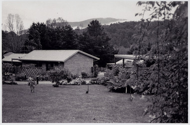 A black and white photograph that shows a few of the residential units that were situated in The Village in Marysville in Victoria.