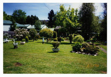 A colour photograph that shows the gardens at the The Village in Marysville in Victoria.