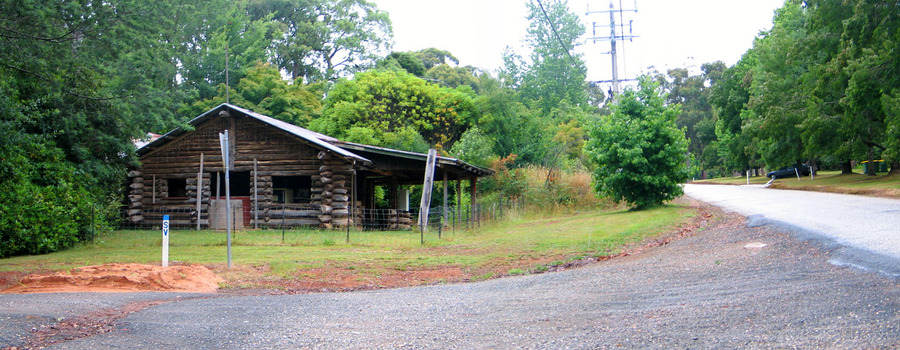 Shows a log cabin on Pack Road in Marysville in Victoria.