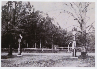 Shows two early petrol pumps in Marysville in Victoria.
