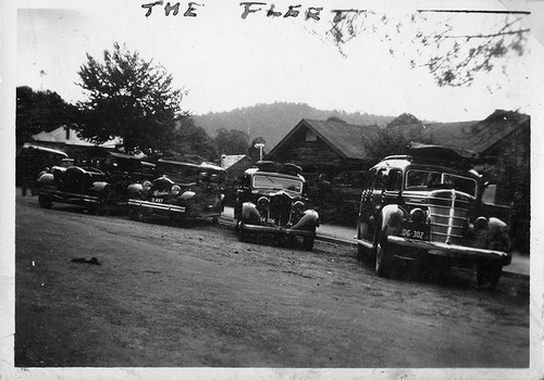 Shows four vehicles parked outside a building in Marysville in Victoria.